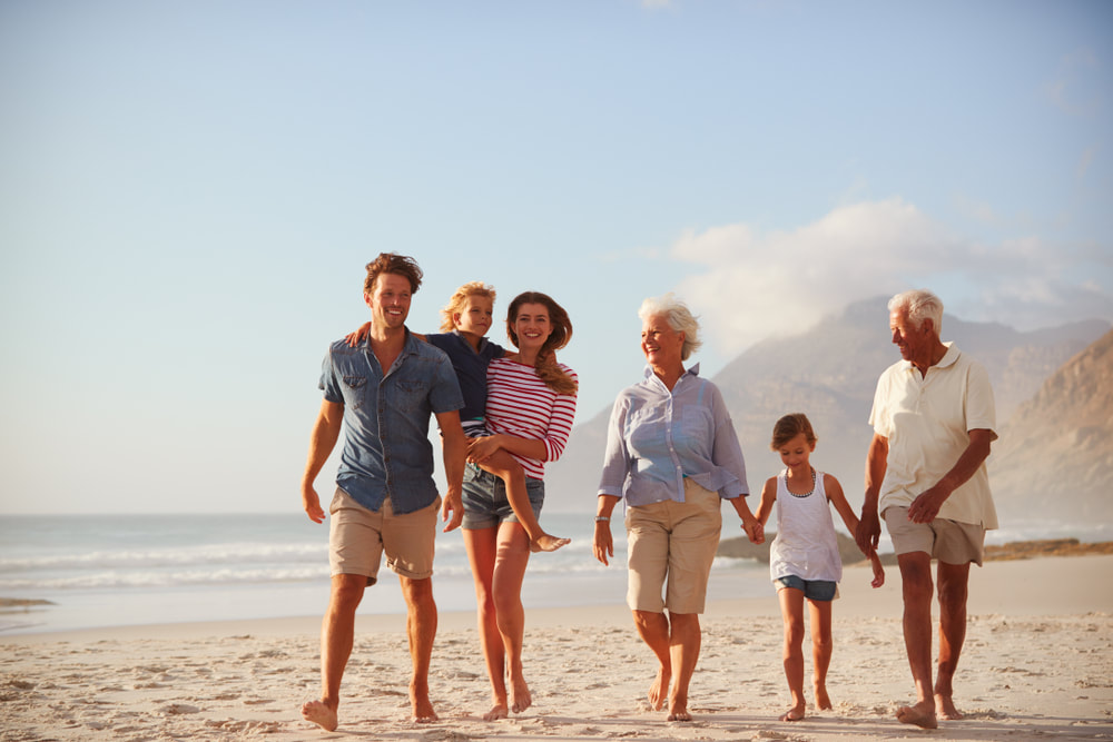 large family on beach